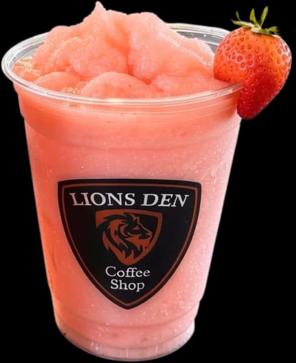 Pink blended smoothie with a strawberry on the rim in a Lions Den Coffee Shop cup